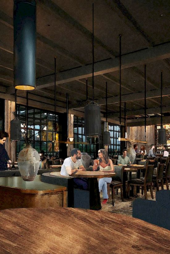 A cozy restaurant or caf&eacute; with people dining and chatting, warm lighting, tables and chairs, a bar area in the background, and wooden decor.